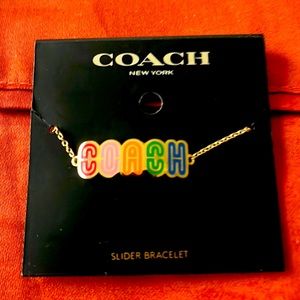 This beautiful necklace from Coach, with varieties of colors. See for yourself.
